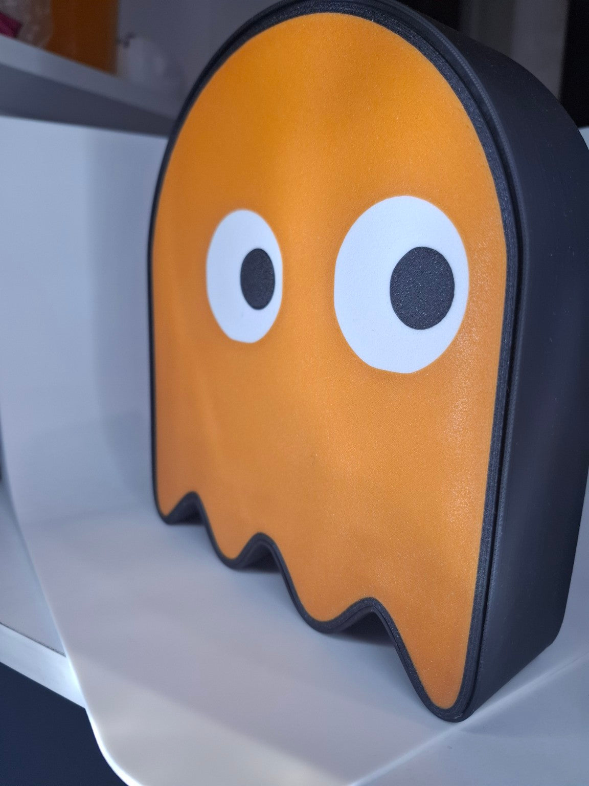 Alcancía Pac-Man fantasma naranjo