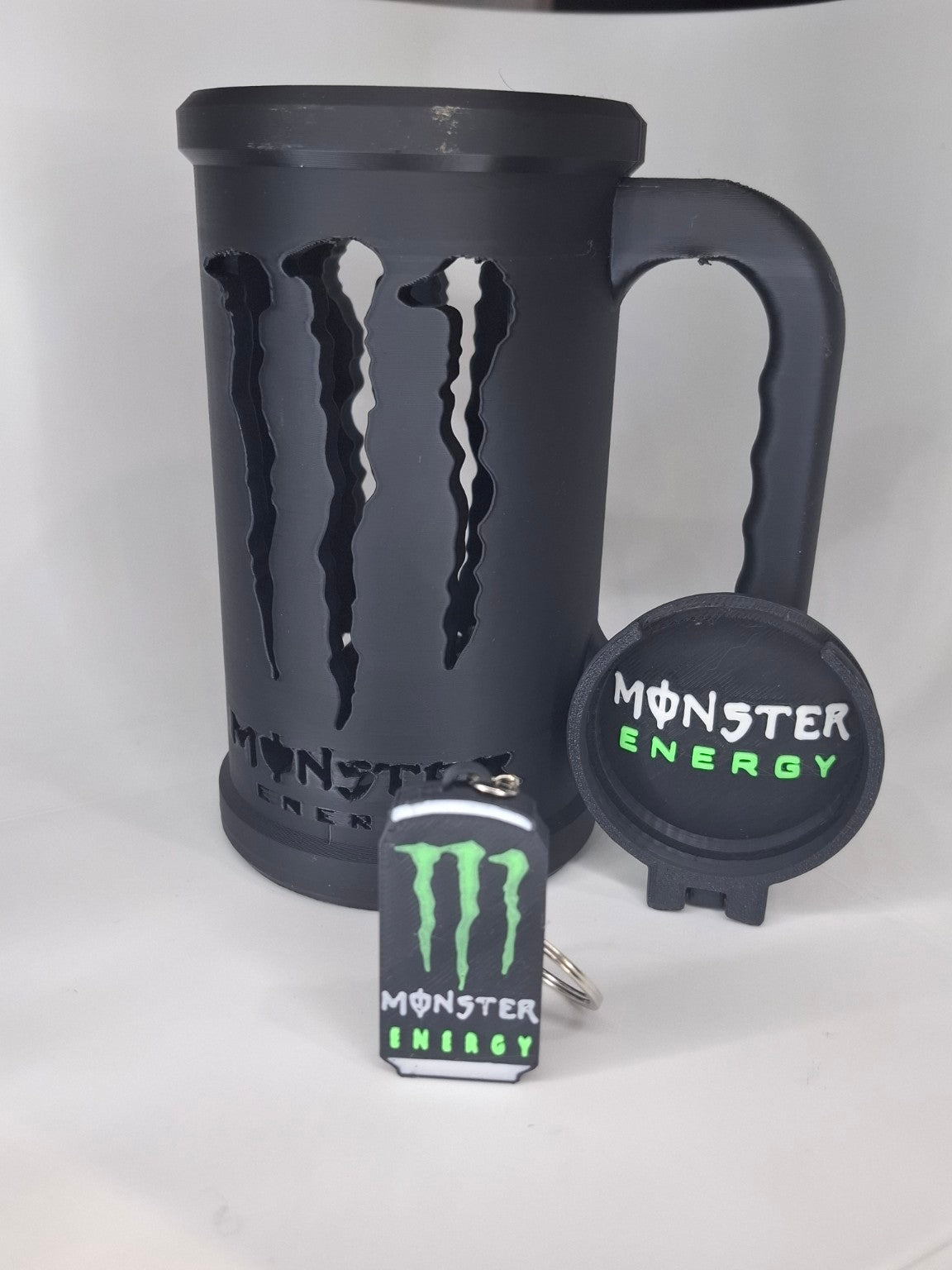 Portalatas Monster Energy negro con accesorios